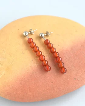 brincos esferas cornalina